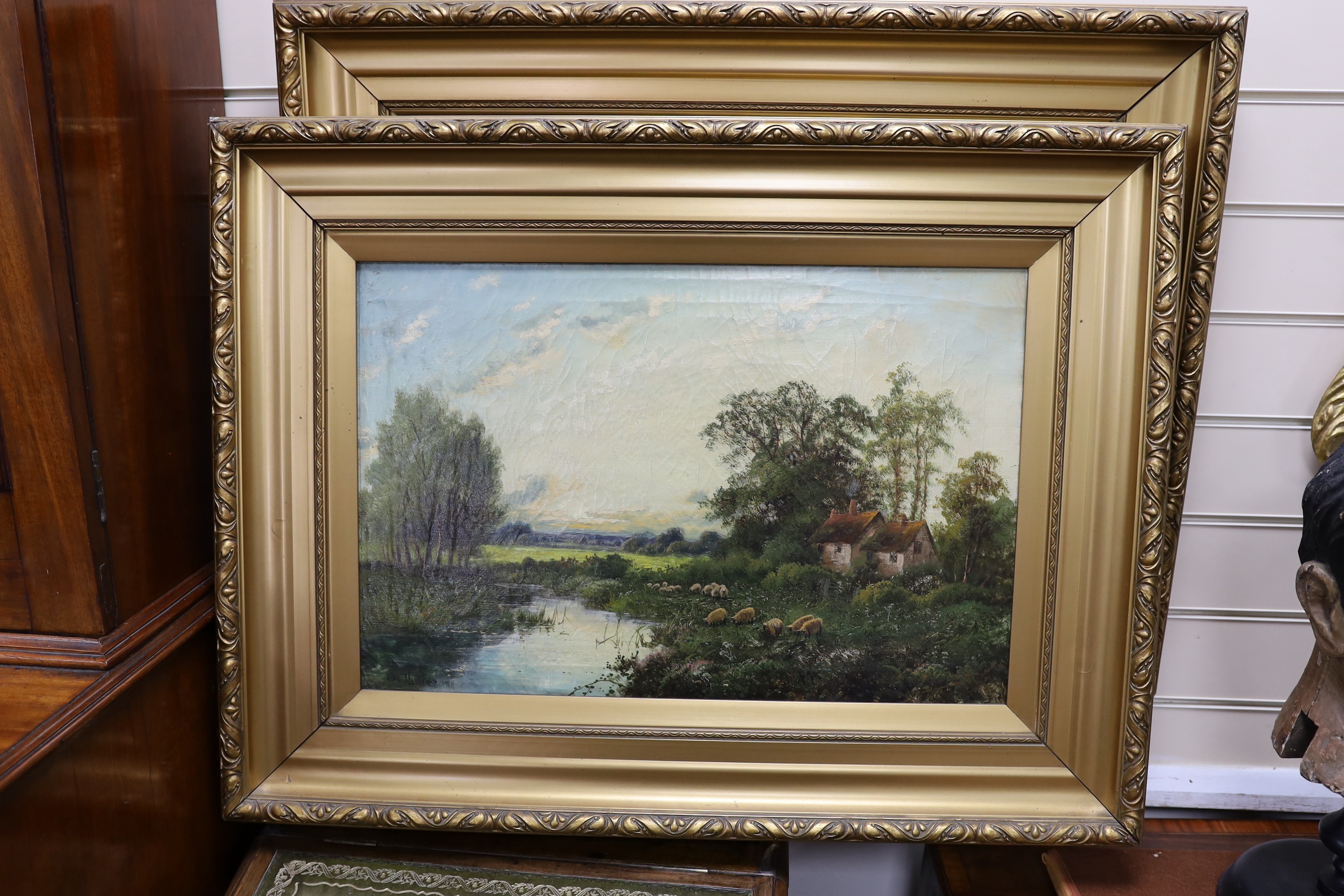 Octavius Thomas (Clark), pair of oils on canvas, River landscapes with sheep and hay barge, signed, 40 x 60cm